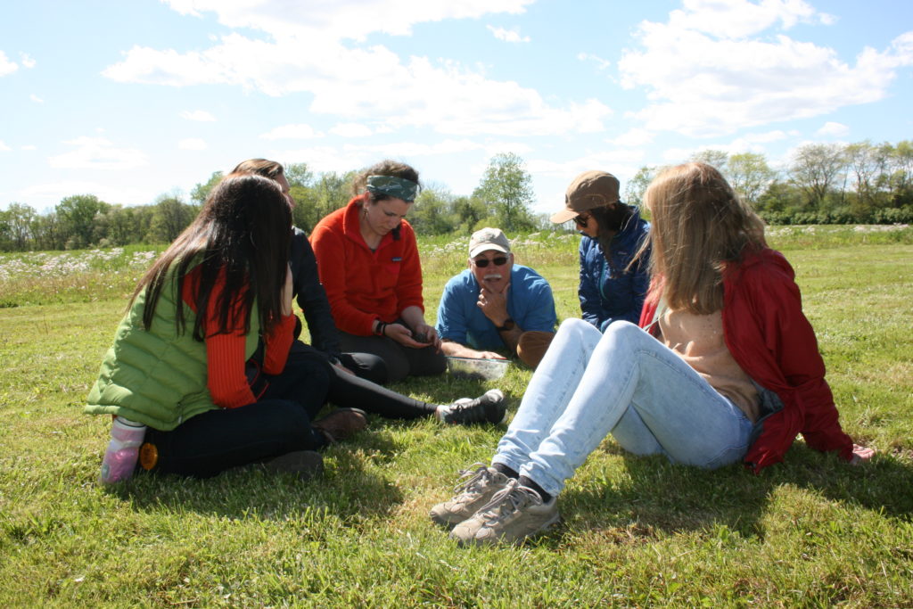 Group seated on the grass at the national monument