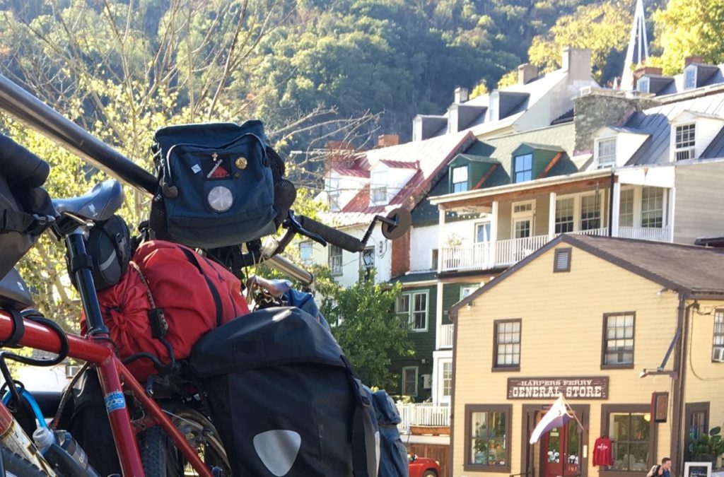 Bile loaded with luggage, parked in a hilly town